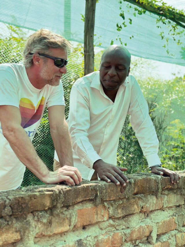 Philippe Grohe engaged in a meaningful dialogue at a model school, exemplifying the growth and tangible ESG impact made possible through WellBoring.