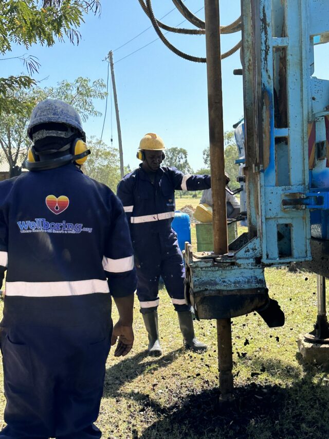 WellBoring Groundwater team at the pivotal moment of drilling a borehole at a school, the drill rig ready to pierce 60 meters deep for a stable water column.