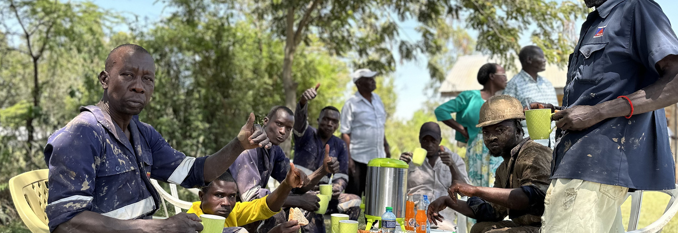 WellBoring Groundwater team members taking a well-deserved lunch break amid their impactful work of drilling boreholes for solar-powered wells at a local school.
